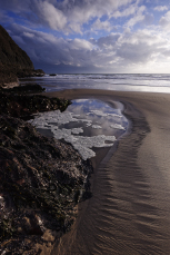 Tiny sand rivulets left as water flows into a tide pool, the rivulets display fractal organisation, Abersoch, Wales, UK, December