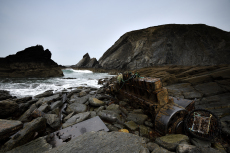 Shipwreck near Porth y Rhaw, Solva. On 18th October 1981, three tugs ran aground on this rocky beach, Pembrokeshire, Wales, UK, May