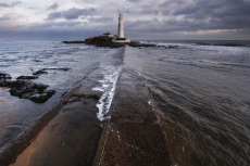 A view along the causeway to St Mary's Island Lighthouse at mid-tide, Whitley Bay, Tyneside, England, UK, December