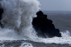 A huge impact wave hitting cliffs during Storm Ciara, near Abersoch, Wales, UK, February 2020