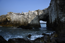 Bwa Gwyn (Welsh) or the White Arch, a natural arch formed in Quartzite near Trearddur Bay, Anglesey, Wales, UK, April
