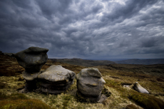 Eroded and sculpted Carboniferous age, Millstone Grit Tors at The Woolpacks, on the southern side of Kinder Scout, above Glossop, Derbyshire, England, UK, April