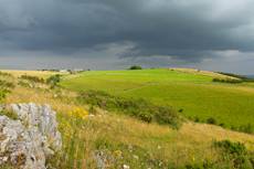 Landscape view of stormy skies and grassland, Draycott Sleights, Somerset, England, UK, August